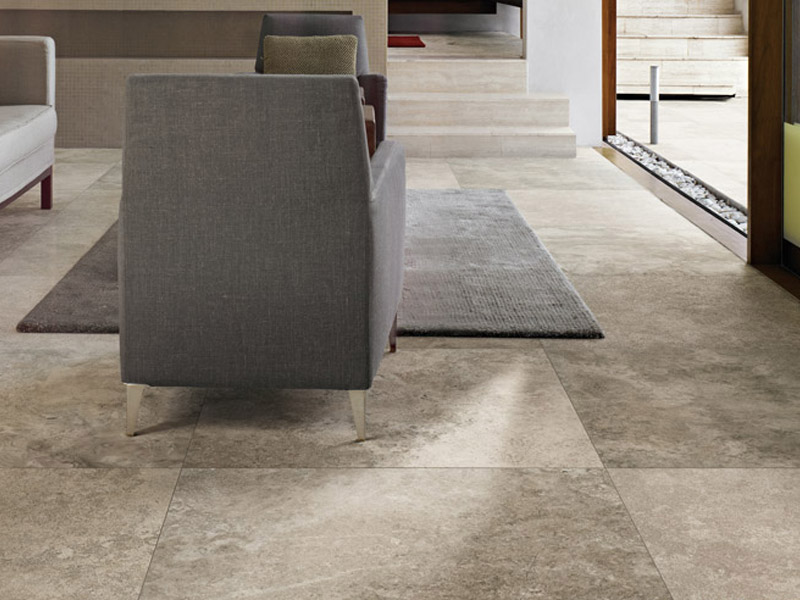 Large Stone Looking Tiles On The Interior Of A Home Can Give The Feel Of Being Outdoors A Very Natural And Large Format Tile Living Room Tiles Stone Look Tile